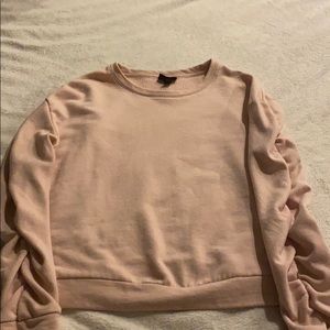 slightly cropped pink sweatshirt